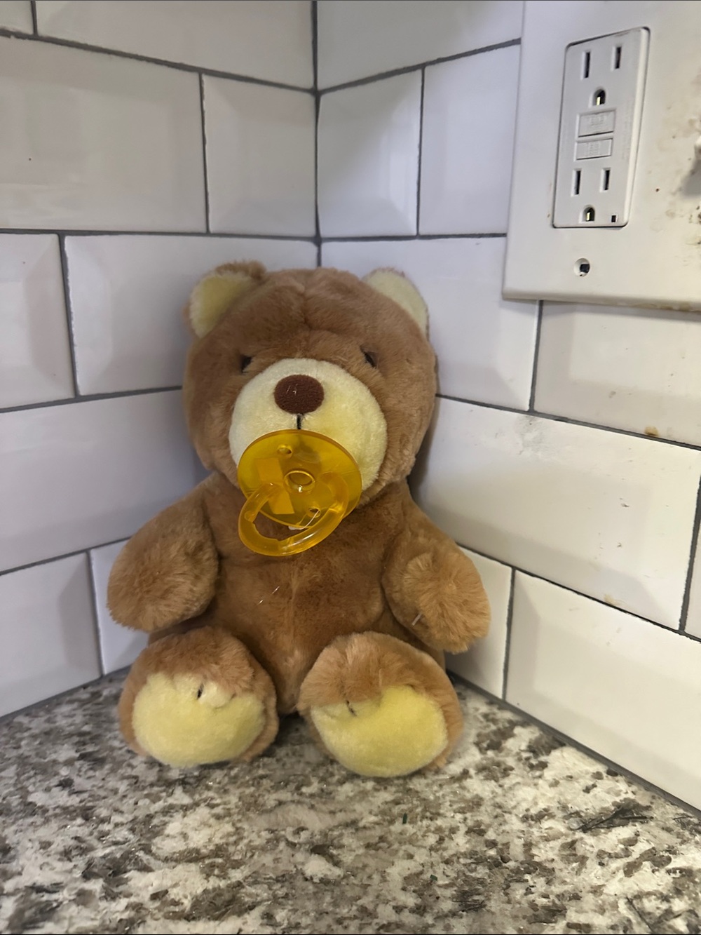 Dankin Plush Brown Bear Soft Toy with Yellow Pacifier